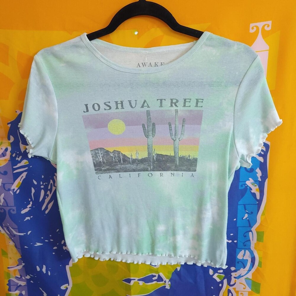 Joshua Tree California baby tee with graphic of cacti and a sun